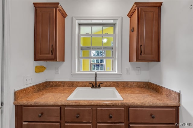 1275 Center St, Aurora, NY 14052 - kitchen with a sink and brown cabinetry