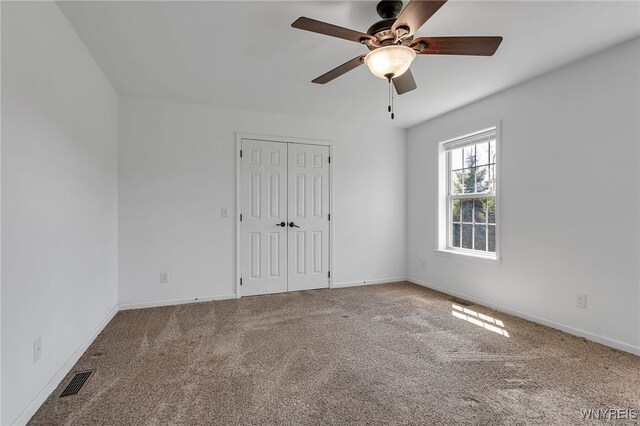 1275 Center St, Aurora, NY 14052 - spare room with carpet, a ceiling fan, and baseboards