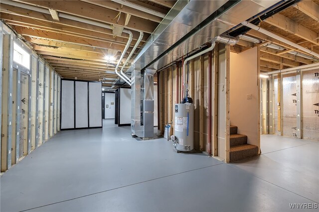 1275 Center St, Aurora, NY 14052 - below grade area featuring water heater, heating unit, and stairs