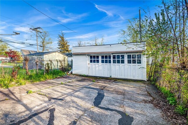 garage with fence