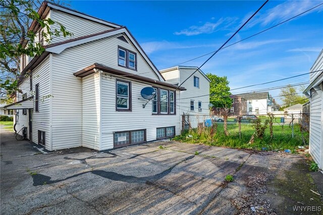 back of property featuring fence