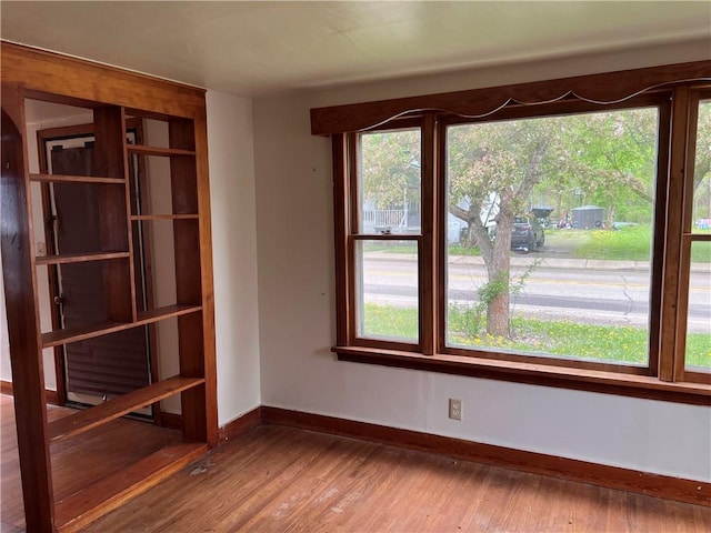 332 Jamestown St, Persia, NY 14070 - unfurnished room with baseboards and wood finished floors