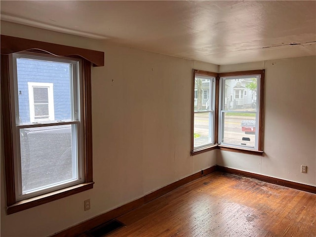 332 Jamestown St, Persia, NY 14070 - empty room featuring wood finished floors and baseboards
