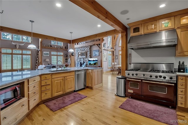 100 May Dr, Elma, NY 14059 - kitchen with appliances with stainless steel finishes, under cabinet range hood, light wood-style floors, a sink, and glass insert cabinets