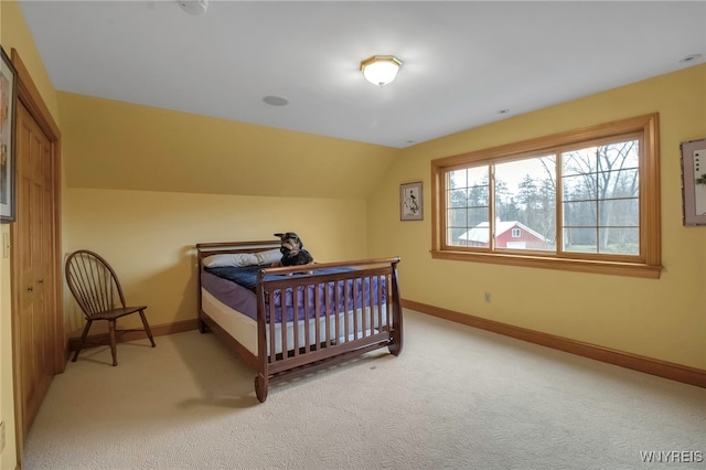 100 May Dr, Elma, NY 14059 - bedroom featuring light carpet, lofted ceiling, and baseboards
