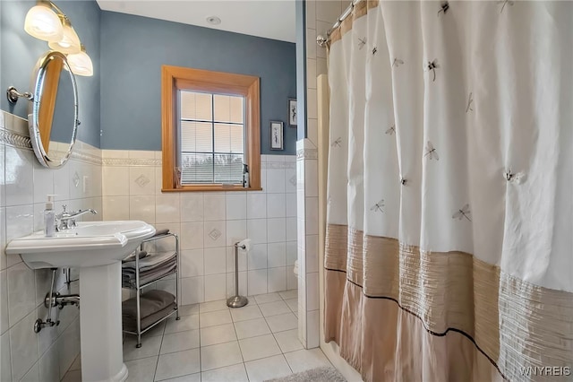 100 May Dr, Elma, NY 14059 - bathroom featuring tile walls, tile patterned floors, a wainscoted wall, and a shower with curtain