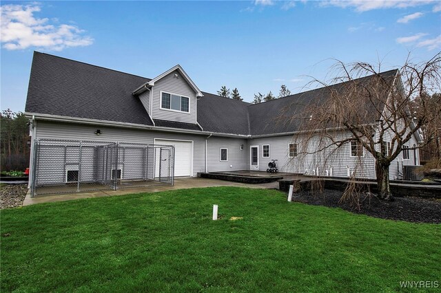 100 May Dr, Elma, NY 14059 - rear view of house with a patio, a lawn, and a garage