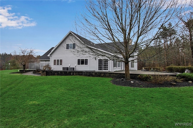 100 May Dr, Elma, NY 14059 - rear view of property featuring a lawn, central AC unit, and a patio area