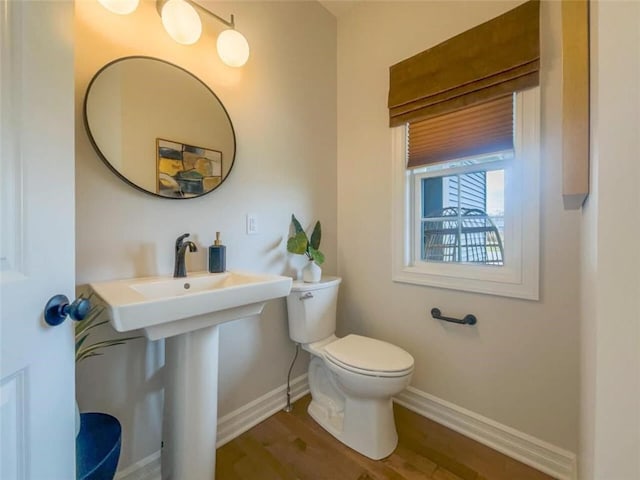 1549 Osburn Ln, Farmington, NY 14425 - half bath with baseboards, toilet, and wood finished floors