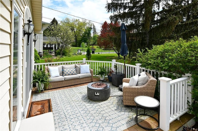 view of patio / terrace with an outdoor living space with a fire pit