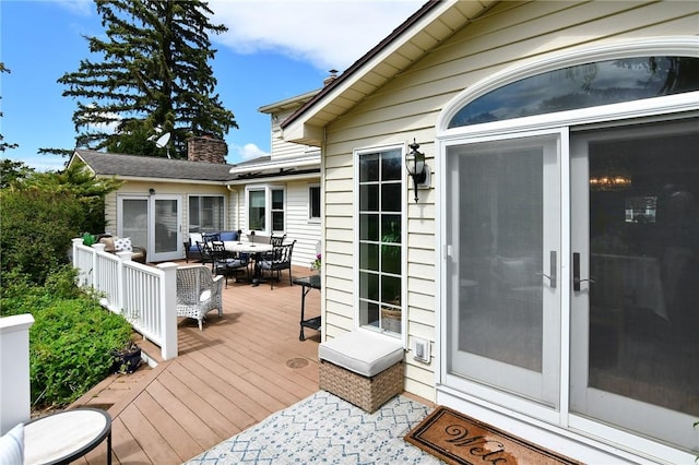 wooden deck with outdoor dining area