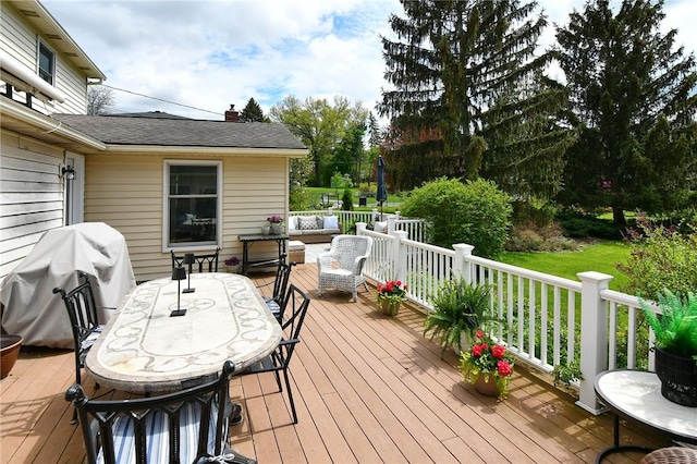 wooden deck with an outdoor hangout area