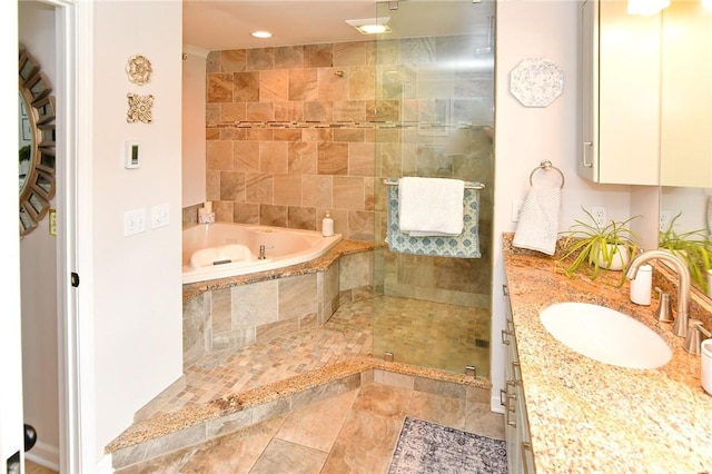 full bathroom featuring tiled shower, a garden tub, vanity, and recessed lighting