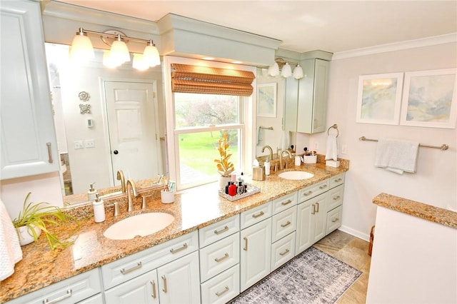 bathroom featuring double vanity and ornamental molding