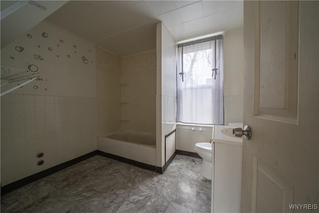 full bath with plenty of natural light, toilet, tile walls, and vanity