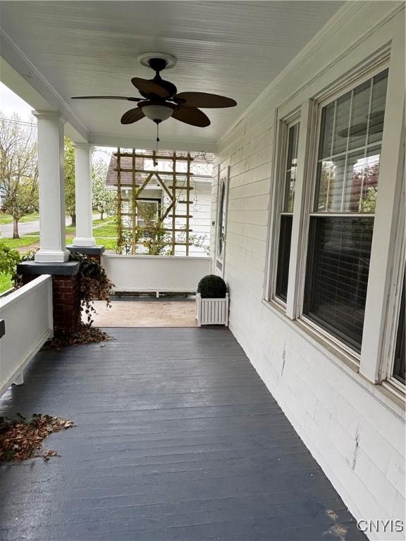 deck featuring a porch and ceiling fan