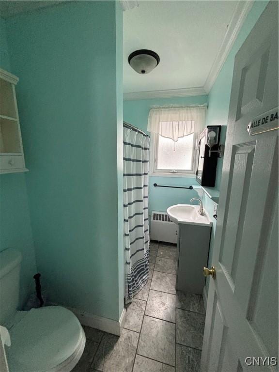 bathroom with crown molding, radiator, toilet, vanity, and a shower with shower curtain