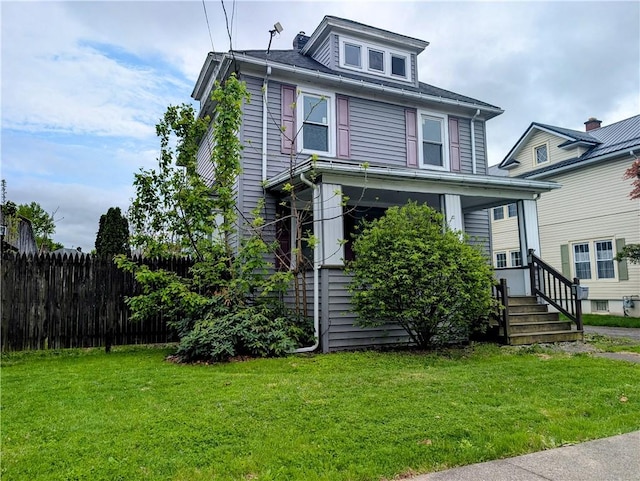 traditional style home with a front lawn