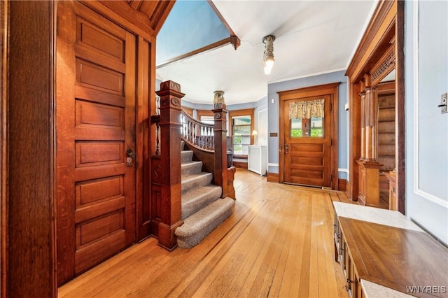 82 Clinton St, Tonawanda-City, NY 14150 - entryway with light wood-type flooring, stairway, and baseboards