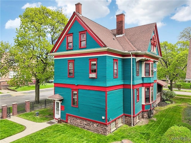 82 Clinton St, Tonawanda-City, NY 14150 - view of property exterior featuring a chimney, cooling unit, and roof with shingles