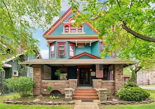 82 Clinton St, Tonawanda-City, NY 14150 - victorian house with a porch and stone siding