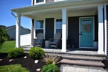 5546 Rolling Meadows Way, Camillus, NY 13031 - property entrance with covered porch