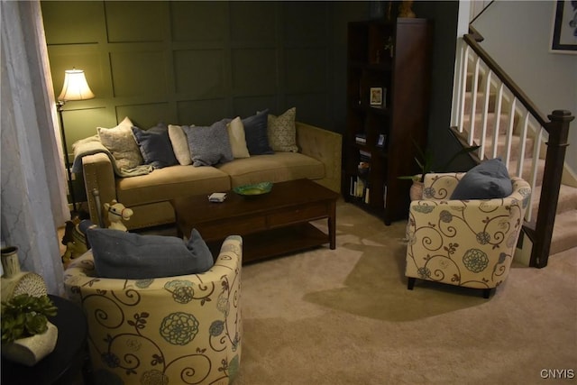 5546 Rolling Meadows Way, Camillus, NY 13031 - living room with light colored carpet, stairway, and a decorative wall