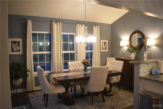 5546 Rolling Meadows Way, Camillus, NY 13031 - dining space featuring a chandelier, vaulted ceiling, and wood finished floors