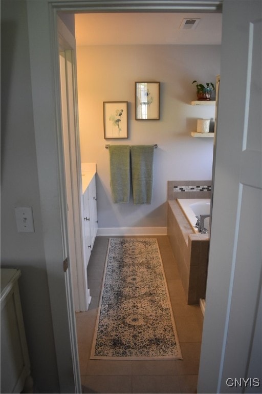 5546 Rolling Meadows Way, Camillus, NY 13031 - bathroom featuring vanity, a garden tub, and tile patterned floors