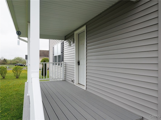 36395 Sarah Ln, Orleans, NY 13656 - wooden deck with covered porch and a lawn