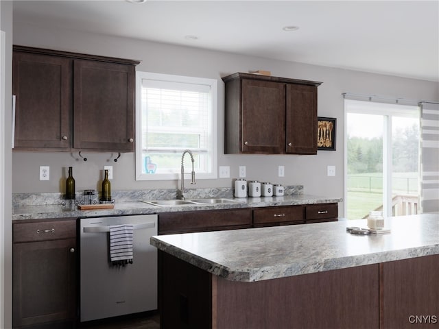 36395 Sarah Ln, Orleans, NY 13656 - kitchen with dishwasher, a sink, and dark brown cabinetry