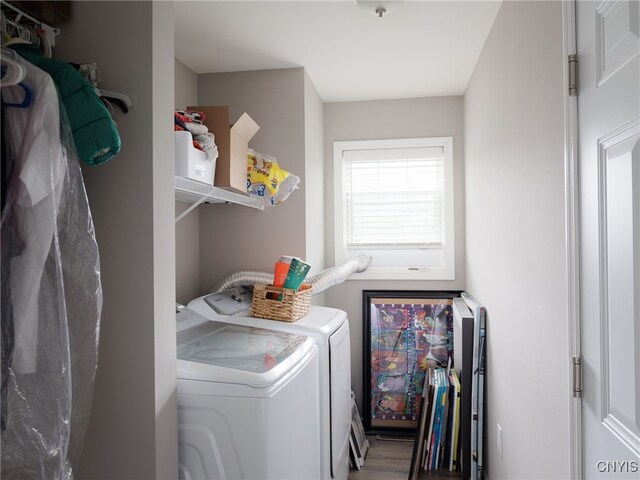36395 Sarah Ln, Orleans, NY 13656 - clothes washing area featuring washer and clothes dryer and wood finished floors