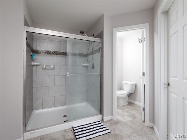 36395 Sarah Ln, Orleans, NY 13656 - full bathroom featuring a shower stall, toilet, and baseboards