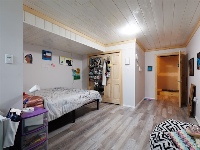 36395 Sarah Ln, Orleans, NY 13656 - bedroom featuring light wood finished floors, a closet, wood ceiling, and baseboards