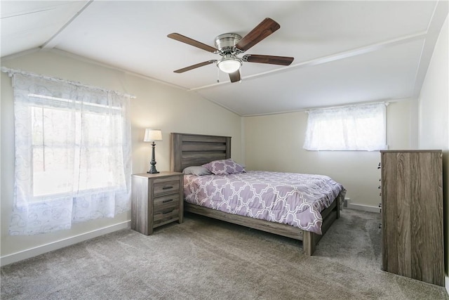 bedroom with vaulted ceiling, carpet floors, baseboards, and a ceiling fan