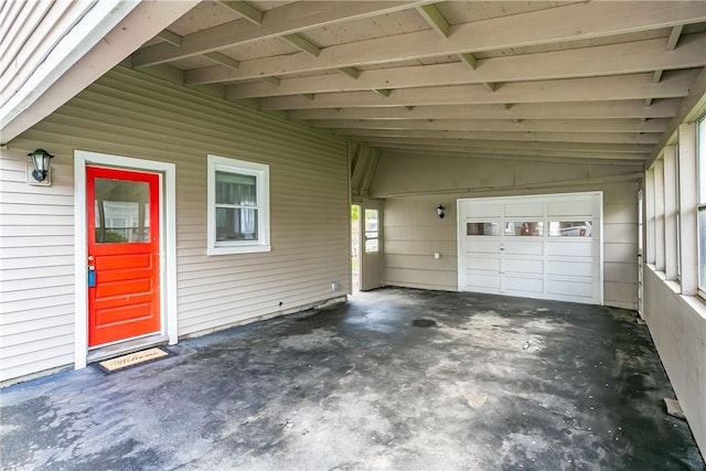 garage featuring an attached carport