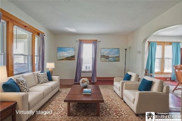 living area with arched walkways