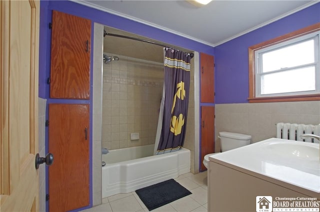 full bath with radiator, tile patterned flooring, toilet, shower / bath combo, and tile walls