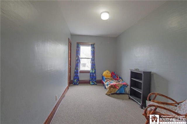 bedroom with carpet flooring and baseboards