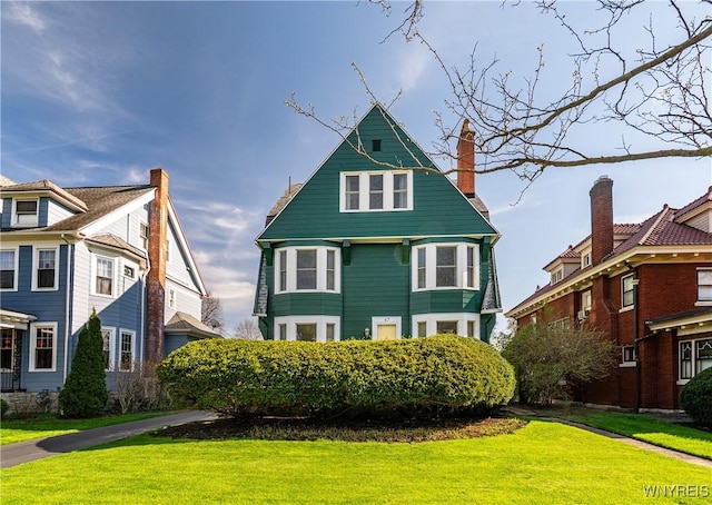 47 Beard Ave, Buffalo, NY 14214 - victorian home with a front yard and a chimney