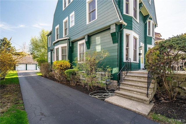 47 Beard Ave, Buffalo, NY 14214 - view of property exterior featuring an outbuilding and a detached garage