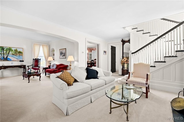 47 Beard Ave, Buffalo, NY 14214 - living area featuring light carpet, stairs, crown molding, and arched walkways