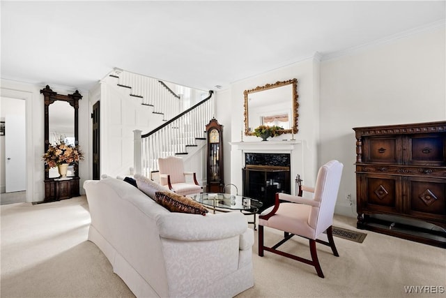 47 Beard Ave, Buffalo, NY 14214 - living area featuring light carpet, a premium fireplace, stairway, and crown molding