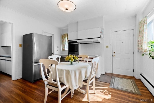 47 Beard Ave, Buffalo, NY 14214 - dining space featuring a baseboard radiator, dark wood-style flooring, and baseboards