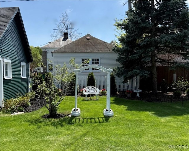47 Beard Ave, Buffalo, NY 14214 - back of house with a chimney and roof with shingles