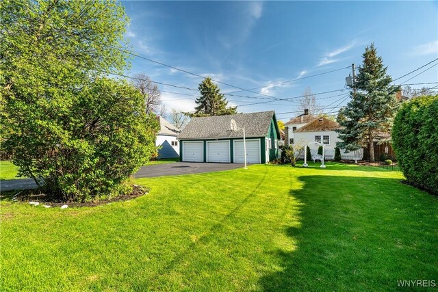 47 Beard Ave, Buffalo, NY 14214 - view of green lawn featuring an outbuilding and a detached garage