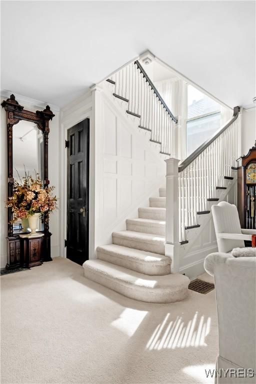47 Beard Ave, Buffalo, NY 14214 - stairway featuring carpet floors