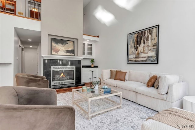 20 Harbour Pointe, Buffalo, NY 14202 - living area featuring wood finished floors, a fireplace, and a towering ceiling