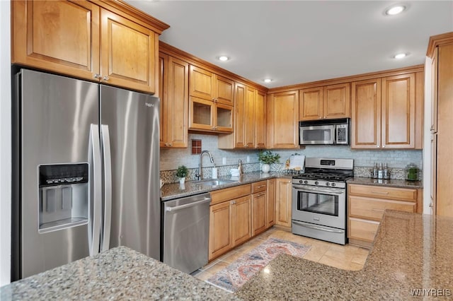 20 Harbour Pointe, Buffalo, NY 14202 - kitchen with appliances with stainless steel finishes, a sink, light stone countertops, backsplash, and light tile patterned flooring