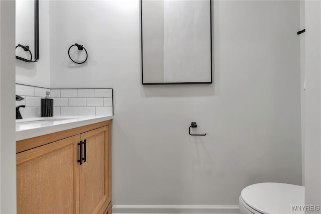 20 Harbour Pointe, Buffalo, NY 14202 - half bath featuring decorative backsplash, vanity, toilet, and baseboards